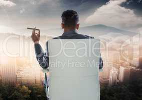 Businessman Back Sitting in Chair  with cigar and city mountain landscape