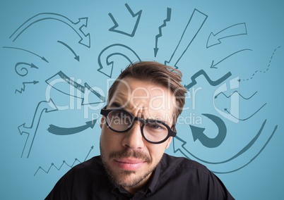 Close up of confused man with glasses against blue background with arrow graphics