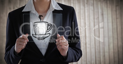 Business woman mid section with glass device behind coffee graphic with flare against blurry wood pa