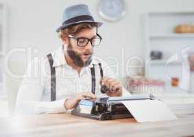 Hipster man  on typewriter in bright room