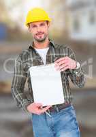 Construction Worker with chart in front of construction site