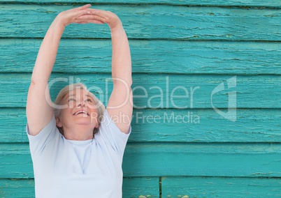 fitness old woman with light blue wood background