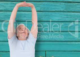 fitness old woman with light blue wood background