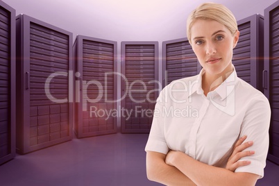 Business woman with arm crossed against the server room