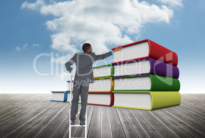 Business man on a ladder against books