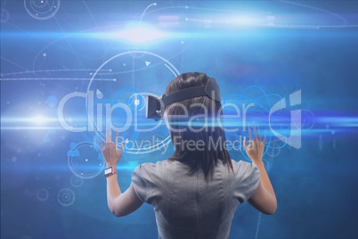 Woman using virtual glasses with blue background