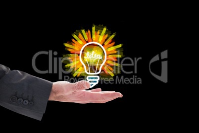 bulb on hands against black background