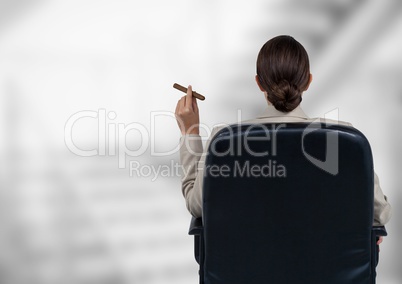 Back of seated business woman smoking cigar against blurry grey stairs