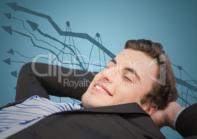 Business man lying back against graph doodle and blue background