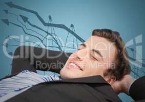 Business man lying back against graph doodle and blue background