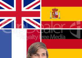 main language flags around young man thinking