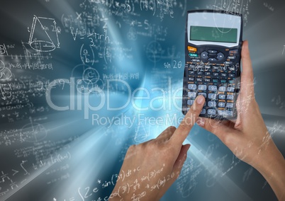 Hands with calculator against blue motion blur with math doodles