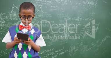Boy in vest and bowtie with calculator against green chalkboard with math doodles
