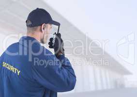 Security man outside bright background warehouses