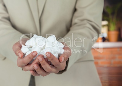 Hands holding sugarcubes