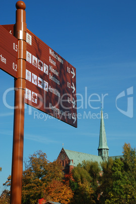 Trail sign in Bad Doberan (Germany) in the background the minste
