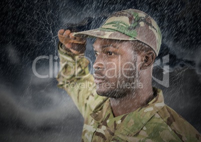 foreground of soldier saluting in the storm.