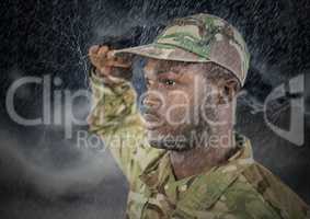 foreground of soldier saluting in the storm.