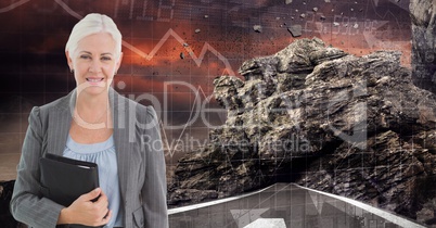 Digital image of businesswoman holding diary while standing on road against rock and graphs