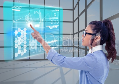 Young woman with contact glasses in a futuristic room with an interface.