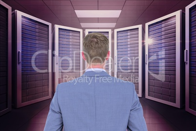 Businessman standing on in a data center