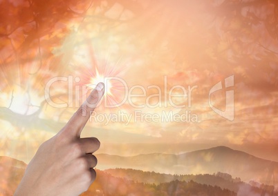 Hand touching orange sky