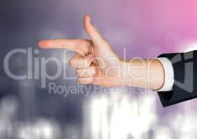 Hand pointing with sparkling light bokeh background