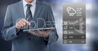 Businessman holding tablet with apps with grey lights background