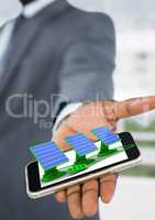solar panels on businessman hand in the office
