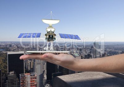 solar panel satellite  on hand with city behind