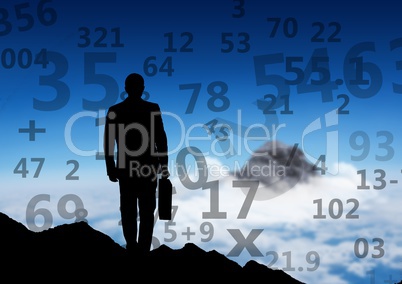 businessman silhouette on the top of the mountain, looking to other mountain. Numbers around him