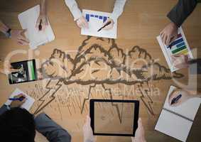 Overhead of business team with wood panel and storm cloud doodle