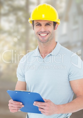 Construction Worker with chart in front of construction site
