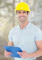 Construction Worker with chart in front of construction site