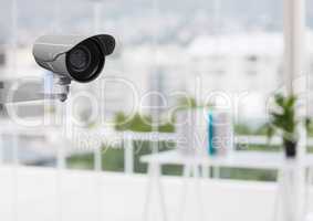 CCTV camera in office against defocused buildings