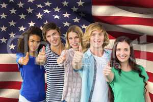 students making thumbs up against American flag background