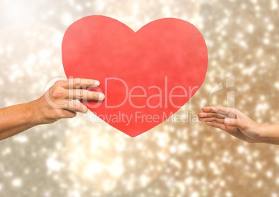 Hands holding heart with sparkling light bokeh background