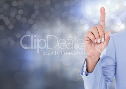 Hand pointing up with sparkling light bokeh background