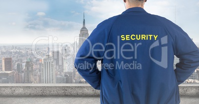 Back of security guard against blurry skyline