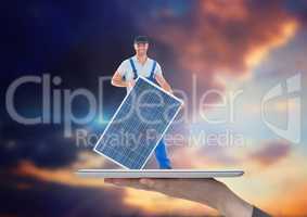 builder with solar panel on tablet on the hand. Sky background