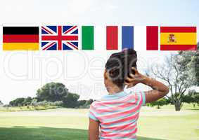 main language flags over girl in the park
