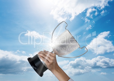 business hand with trophy blue sky and flares