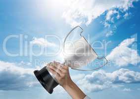 business hand with trophy blue sky and flares
