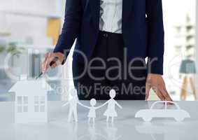 Cut outs of insurance with woman in bright room