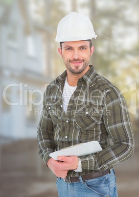 Construction Worker with pen chart in front of construction site