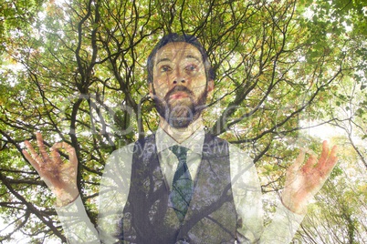 Man doing yoga under a tree