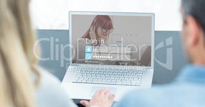 Cropped image of man and woman entering login password on laptop