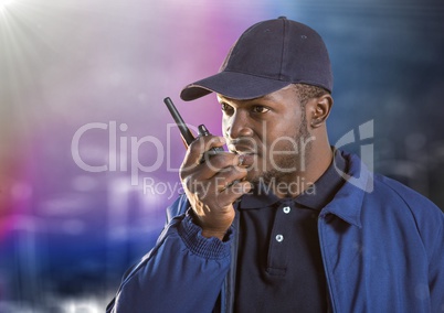 Security guard with walkie talkie against blurry wall with building sketch and flare