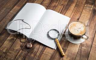 Book, magnifier, clock, coffee
