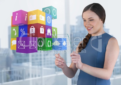 Businesswoman holding glass screen with apps icons